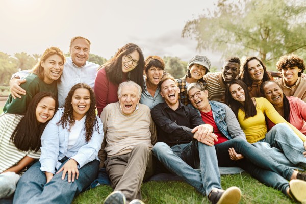 Family walking outdoors in nature, representing wellness and vitality